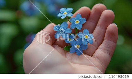 AI-generated content. A person holding a small blue flower in their hand, AI 110498019