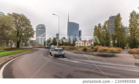 Panorama showing skyscrapers and towers from park with green lawn timelapse in Milan Panorama showing skyscrapers and towers from park with green lawn timelapse in Milan 110499388