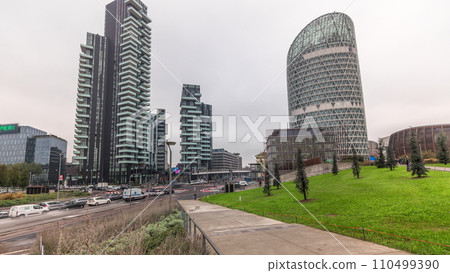 Panorama showing skyscrapers and biblioteca from park with green lawn timelapse in Milan 110499390