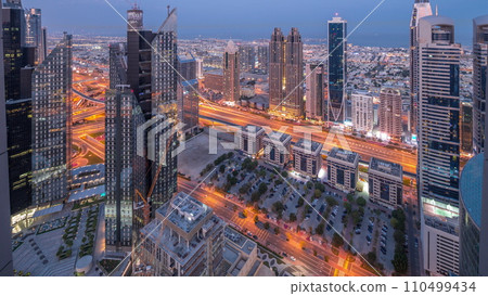 High-rise buildings on Sheikh Zayed Road in Dubai aerial night to day timelapse, UAE. High-rise buildings on Sheikh Zayed Road in Dubai aerial night to day timelapse, UAE. 110499434