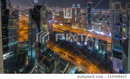 High-rise buildings on Sheikh Zayed Road in Dubai aerial all night timelapse, UAE. 110499435