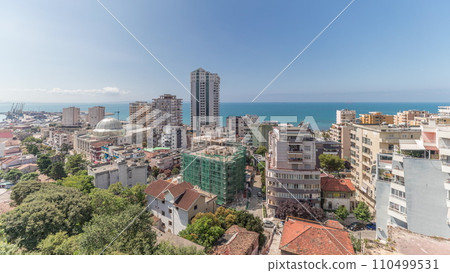 Panorama showing aerial view of city center and the harbor of Durres timelapse from viewpoint, Albania. Panorama showing aerial view of city center and the harbor of Durres timelapse from viewpoint, Albania. 110499531