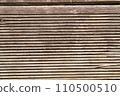 A textured processed wooden surface, a highly detailed close-up of wood grain 110500510