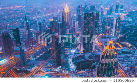 4K Hyperlapse Financial Business District Street Background Backdrop Concept Night Time Lapse. City Traffic And Skyscrapers. Elevated View Cityscape Skyline. Night Light Lighting timelapse 110500689