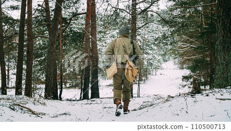 Heroes Of War. American Infantry Soldier Marching Through Forest 110500713