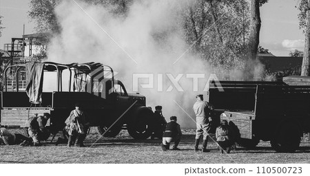Soviet Russian Soldier Or Partisans With German Infantry Soldiers World War Ii. Shell Explosions. Black and White 110500723