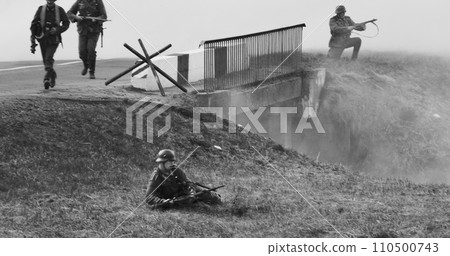 German Infantry Soldiers Fighting With Russian Soldiers. Mortar Shooting, Explosions. Black And White German Infantry Soldiers Fighting With Russian Soldiers. Mortar Shooting, Explosions. Black And White 110500743