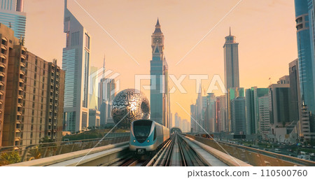 Dubai, UAE, United Arab Emirates. Monorail POV Subway train rides among skyscrapers, Museum of the Future in Dubai 110500760