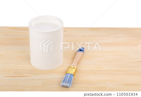 white paint with a brush on a wooden background with texture 110501934