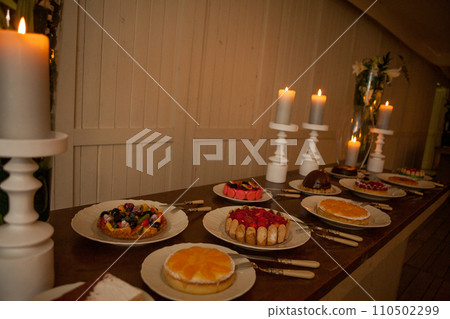Candlelit Confections: An Array of Decadent Desserts 110502299