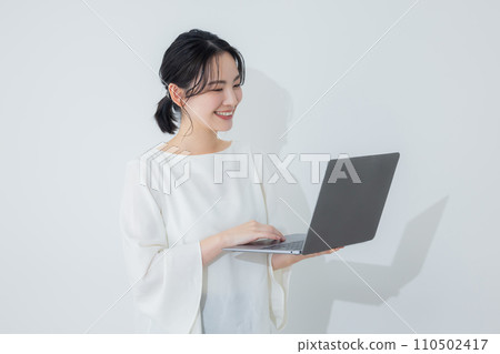 A woman with a laptop 110502417