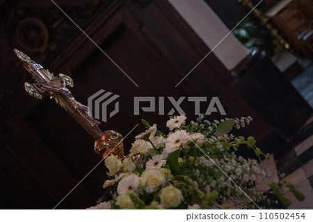 Sacred Symbolism: The Cross Amidst Floral Peace 110502454