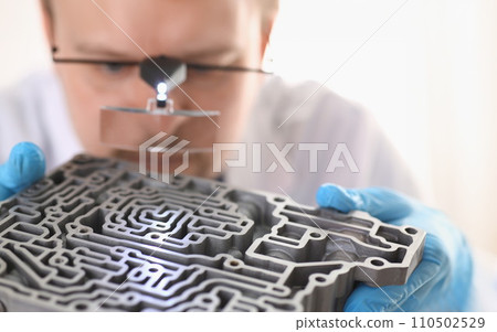 Repairman car-care center on repair holds in hand Repairman car-care center on repair holds in hand 110502529