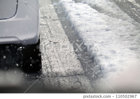 Driving the snow road 110502967