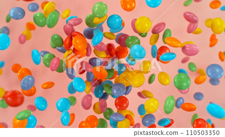 Freeze motion of flying various kind of candies. Colored abstract sweet background. 110503350
