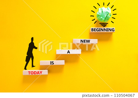 Today is a new beginning symbol. Concept words Today is a new beginning on wooden blocks. Beautiful yellow table yellow background. Businessman icon. Business today new beginning concept. Copy space Today is a new beginning symbol. Concept words Today is a new beginning on wooden blocks. Beautiful yellow table yellow background. Businessman icon. Business today new beginning concept. Copy space 110504067