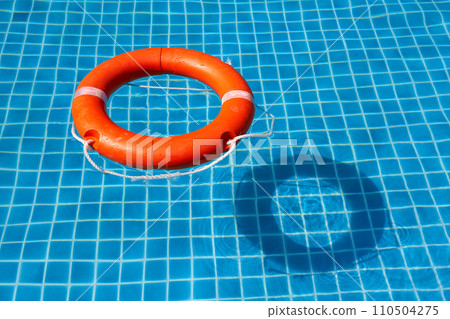 A view from above of the pool in which the life preserver is thrown A view from above of the pool in which the life preserver is thrown 110504275