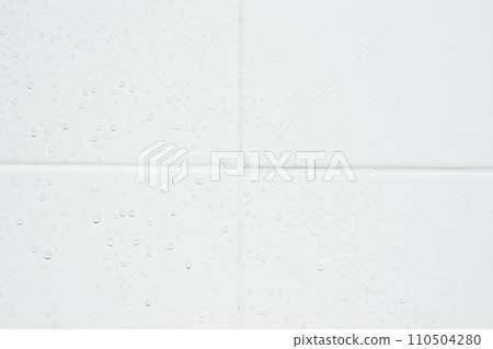 drop of water on white tiles wall texture background. 110504280