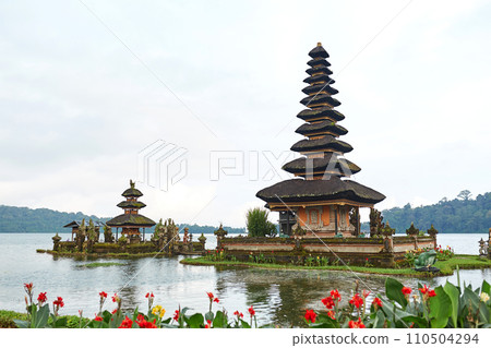 Pagoda at the sacred temple of Pura Ulun on Lake Bratan on the popular touristic island of Bali. 110504294