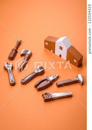 Repair or home improvement tools and a house model on a plain background 110504429