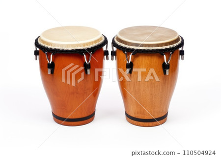 Two wooden drums with black straps. Bongo drums isolated on a white background Two wooden drums with black straps. Bongo drums isolated on a white background 110504924