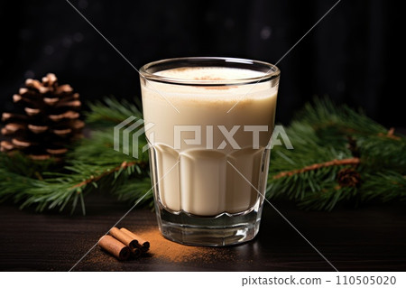 Christmas hot drink. Eggnog with cinnamon in glass 110505020