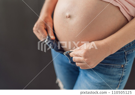 Struggling with jeans. Embrace comfort with maternity wear designed for your growing belly 110505125