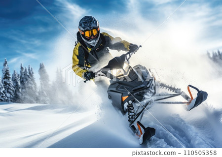 Fun ride on a snowmobile in deep snow. Outdoor sports activity during winter vacation Fun ride on a snowmobile in deep snow. Outdoor sports activity during winter vacation 110505358