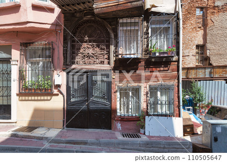Old traditional wooden and stone houses in old Balat district, on a summer day, Istanbul, Turkey Old traditional wooden and stone houses in old Balat district, on a summer day, Istanbul, Turkey 110505647