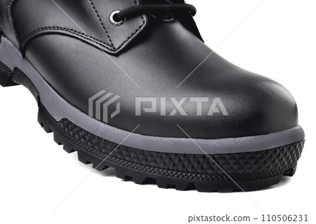 Winter male black leather boot on a white background, hiking shoes, practical off-road shoes, close-up details of the model 110506231