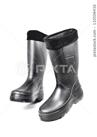 black high insulated specialized boots for hunting off-road fishing and traveling in the cold season on a white background 110506416