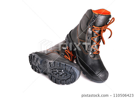 Black high boots with orange laces on a white background, off-road shoes, isolate, close-up Black high boots with orange laces on a white background, off-road shoes, isolate, close-up 110506423