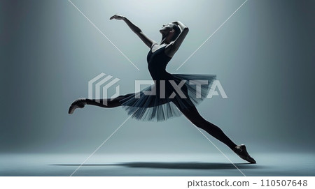Dance of Shadows: A ballet dancer's silhouette is cast against a textured background Dance of Shadows: A ballet dancer's silhouette is cast against a textured background 110507648