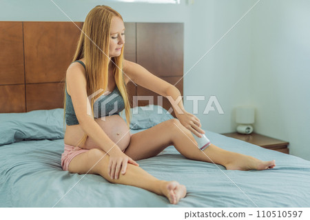 Expectant woman faces challenges while doing leg epilation during pregnancy Expectant woman faces challenges while doing leg epilation during pregnancy 110510597