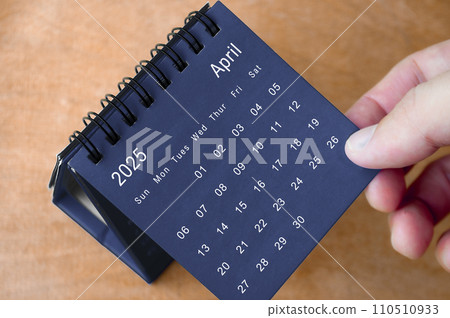 April 2025 black and white calendar on wooden desk. Calendar and new month concept April 2025 black and white calendar on wooden desk. Calendar and new month concept 110510933