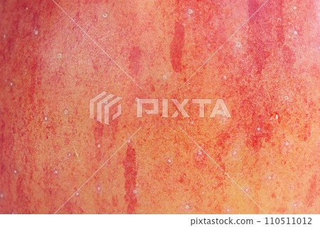 The texture of a delicious fresh apple as a background. Apple as a material for a designer. The texture of a delicious fresh apple as a background. Apple as a material for a designer. 110511012