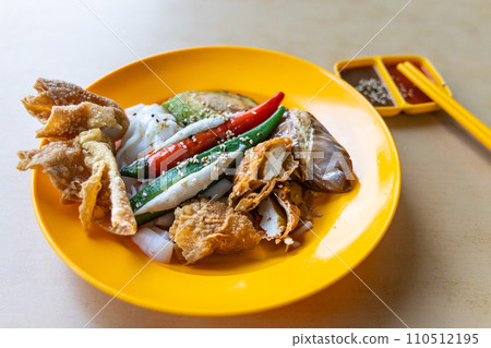 Yong tofu with chee cheong fun combination served in plate with sauces, popular street food in Malaysia 110512195
