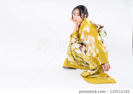 Young woman in long-sleeved kimono Young woman in long-sleeved kimono 110512281