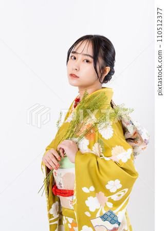 Young woman in long-sleeved kimono 110512377