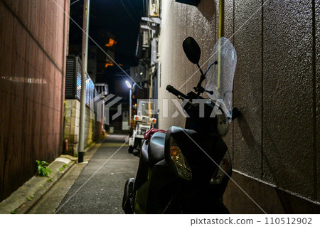 Night alley and parked bikes Night alley and parked bikes 110512902