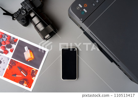 Printer and photo camera on table. Printing photos concept 110513417