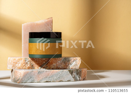 Cosmetic product jar in composition with granite stones and shadow Cosmetic product jar in composition with granite stones and shadow 110513655