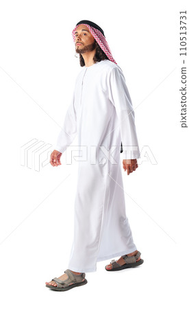 Full-length portrait of young middle-east man in thobe dress on white background 110513731
