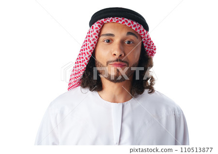 Portrait of a young Arab man wearing middle-eastern traditional dress thobe isolated on white Portrait of a young Arab man wearing middle-eastern traditional dress thobe isolated on white 110513877