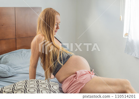 Expectant woman enters the labor phase, navigating the intense journey of childbirth with strength, resilience, and the anticipation of welcoming new life Expectant woman enters the labor phase, navigating the intense journey of childbirth with strength, resilience, and the anticipation of welcoming new life 110514201