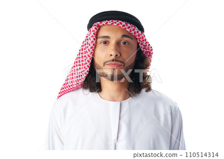 Portrait of a young Arab man wearing middle-eastern traditional dress thobe isolated on white Portrait of a young Arab man wearing middle-eastern traditional dress thobe isolated on white 110514314
