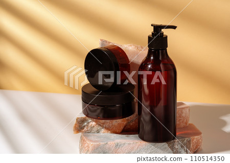 Cosmetic products packages and granite stone studio shot 110514350