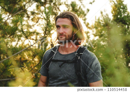 Portrait of hiker man with backpack trekking in the mountains 110514458