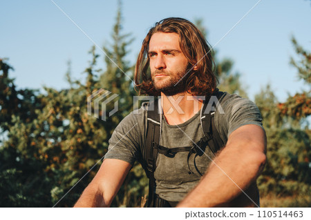 Portrait of hiker man with backpack trekking in the mountains Portrait of hiker man with backpack trekking in the mountains 110514463