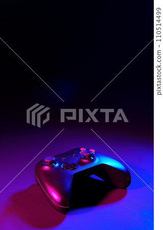 Gaming joystick on black background in neon light Gaming joystick on black background in neon light 110514499